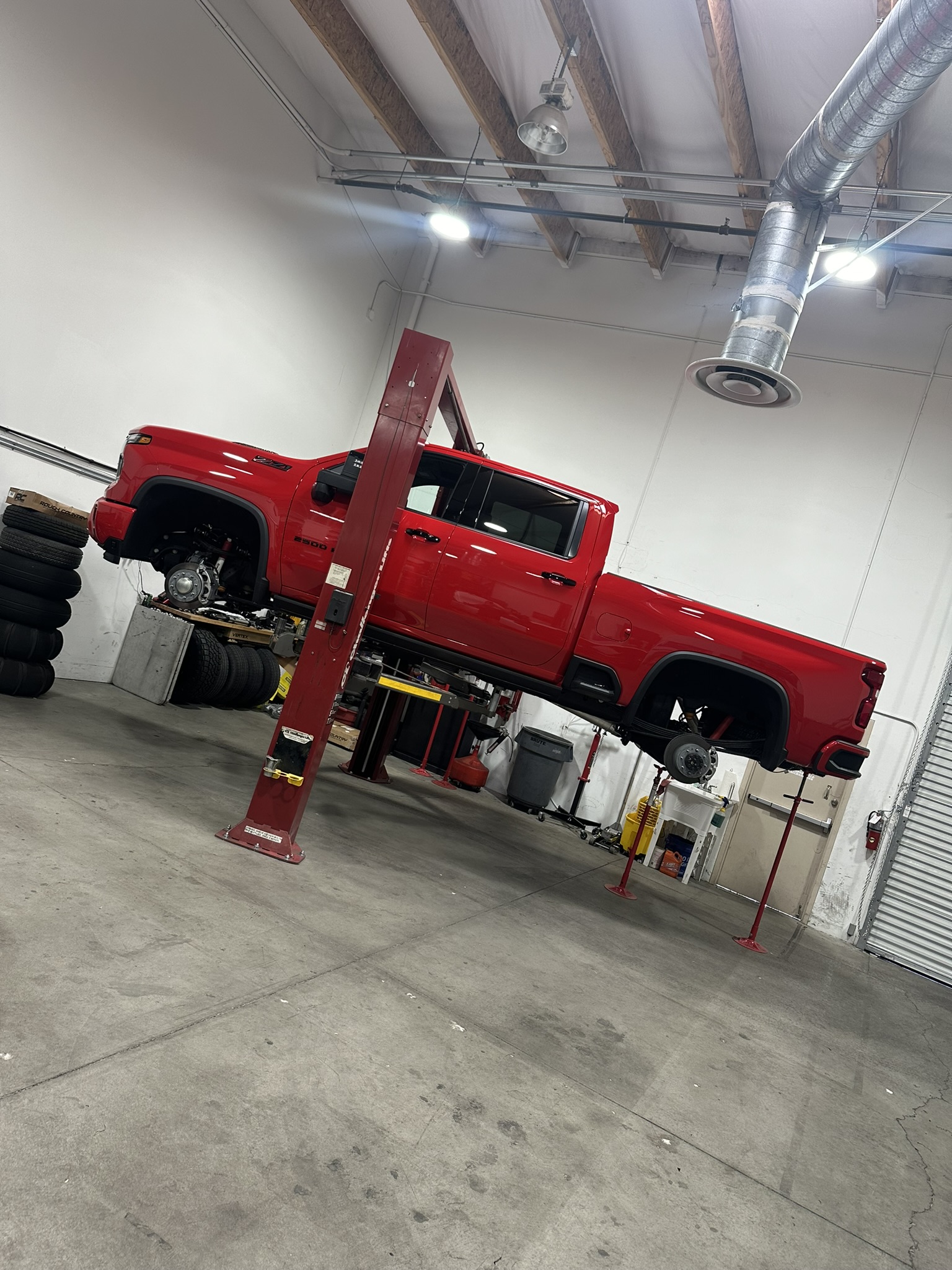 Silverado 2500HD on the shop lift with its wheels removed
