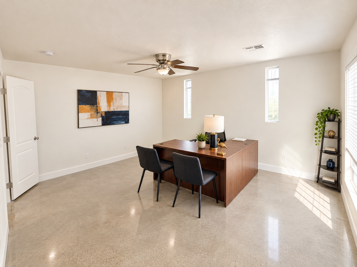 Rear view highlighting the office depth, comfortable layout, and professional setting.