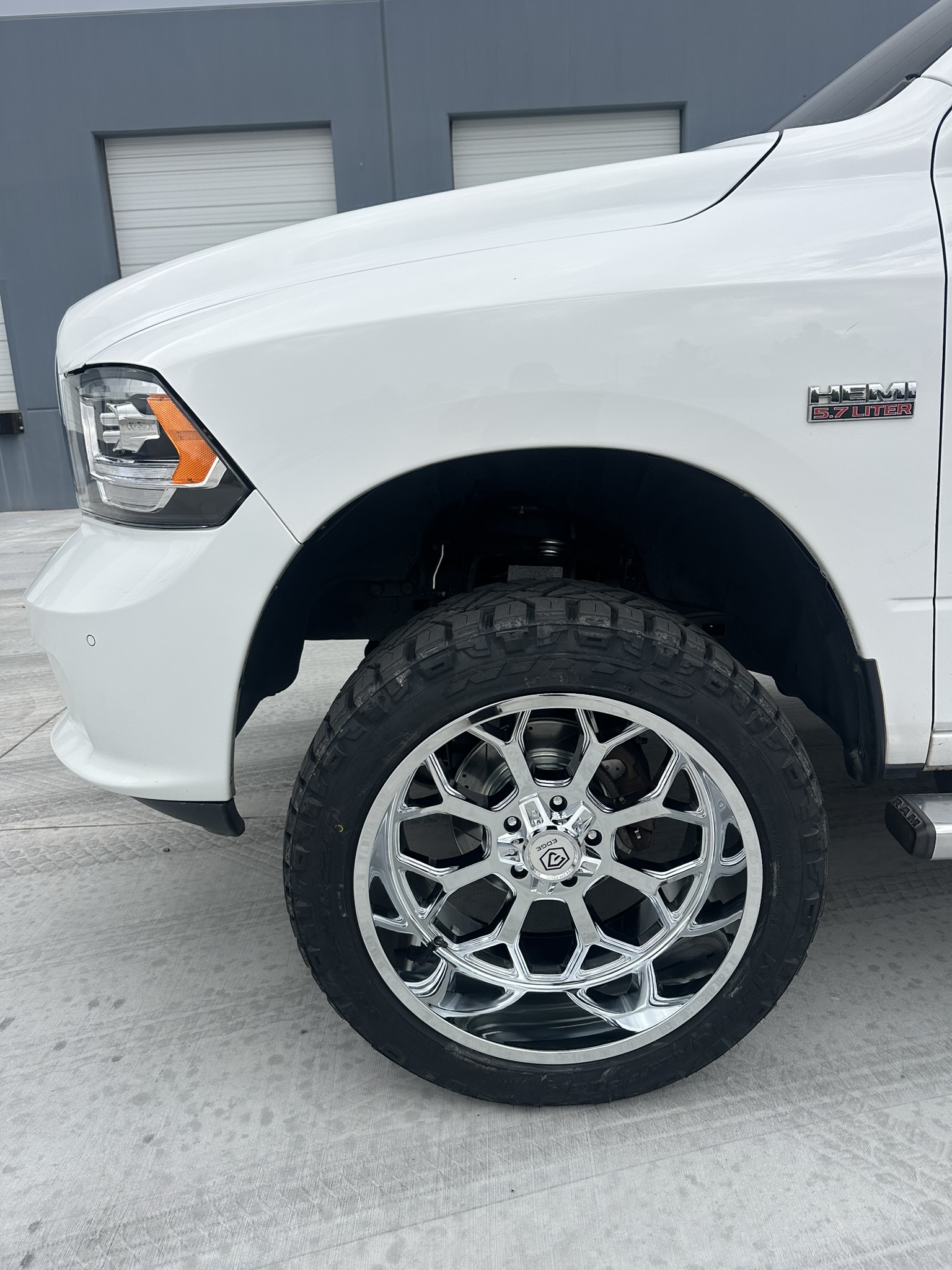 Installed chrome Edge front wheel on the finished white Ram 1500