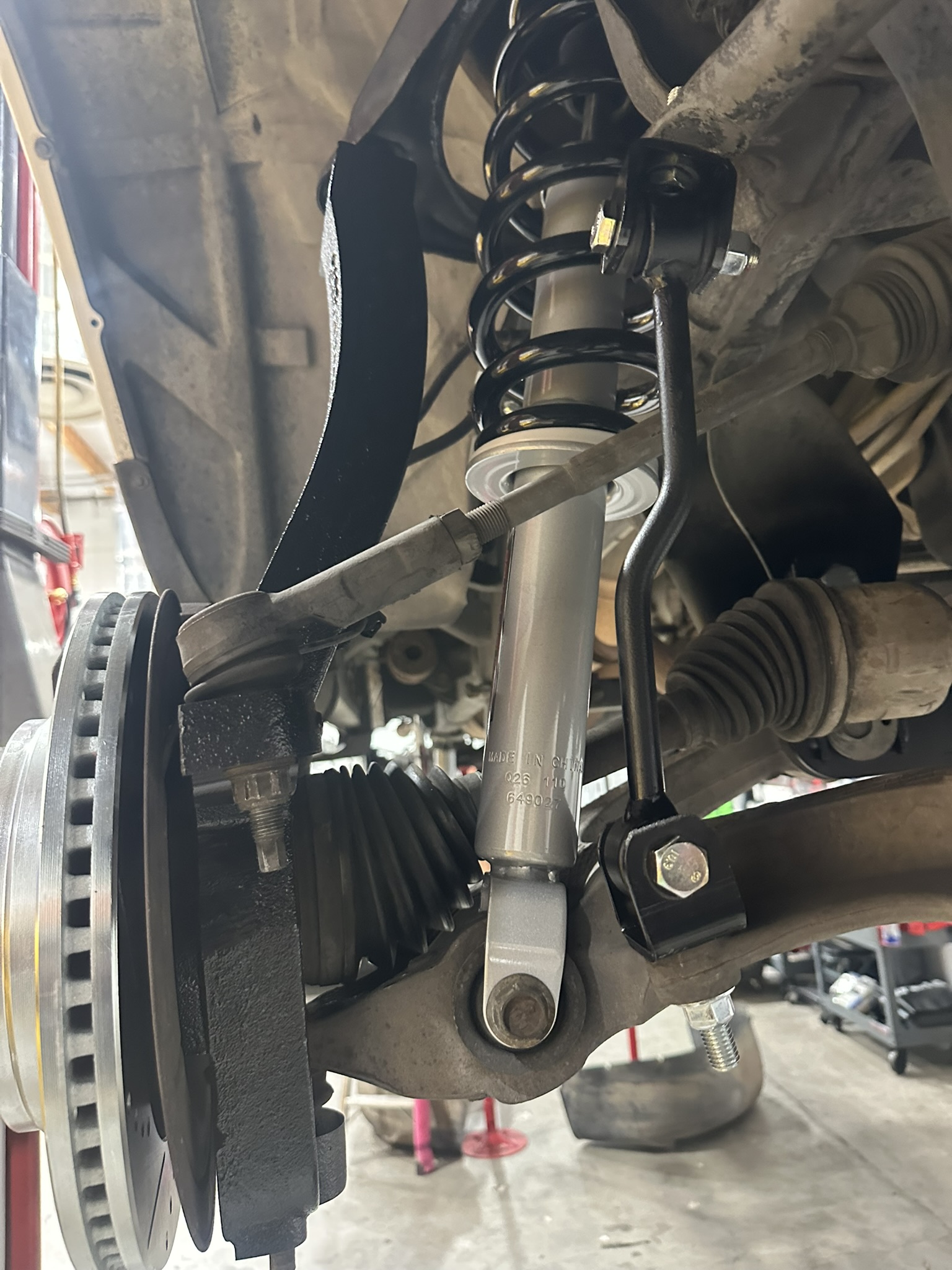 Conventional front coil spring and shock installed on the Ram 1500