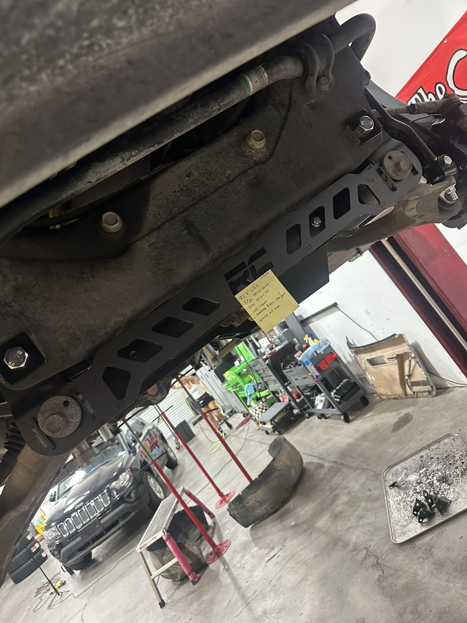 Installed Rough Country lift crossmember beneath the Ram 1500