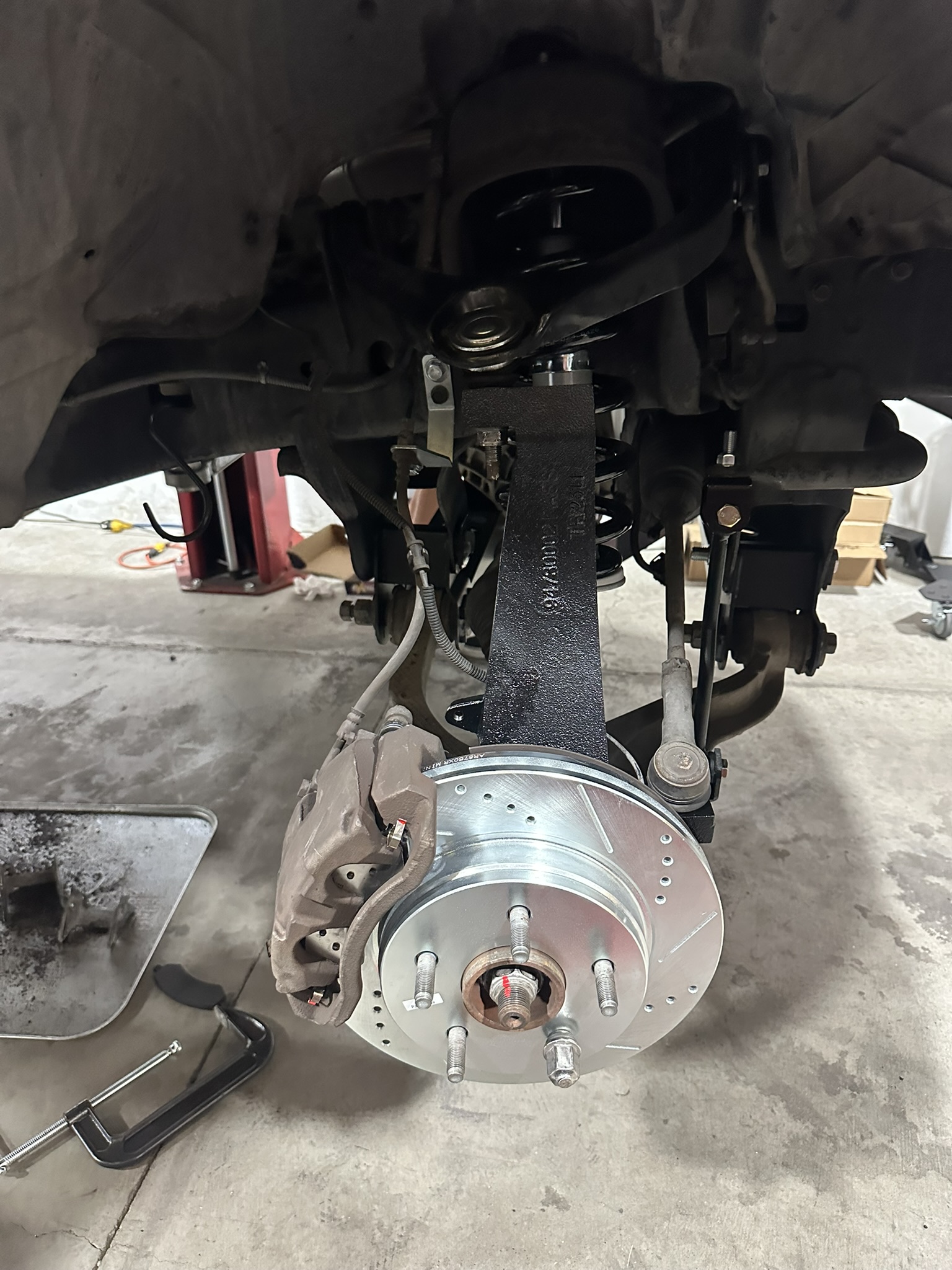 PowerStop drilled-and-slotted front rotor with converted suspension on the Ram 1500